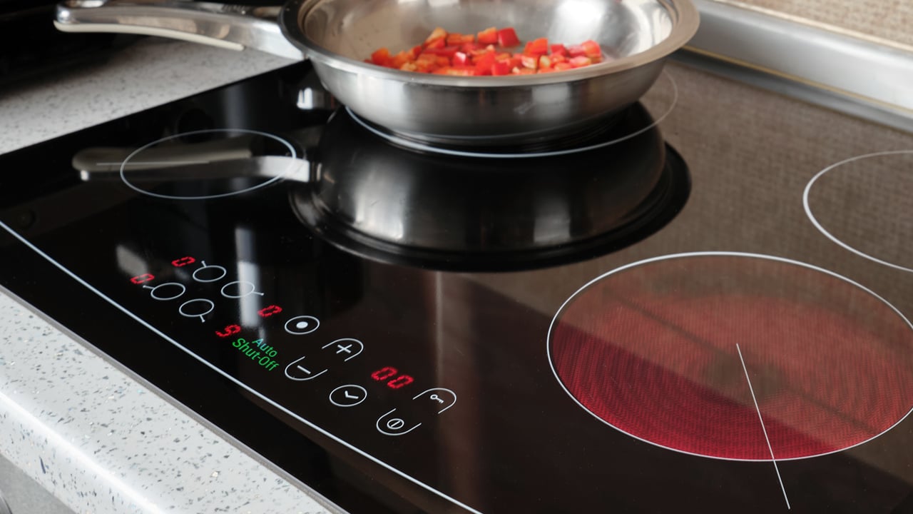 Auto shut-off indicator on control panel turned of modern electric cooking stove for functional safety..