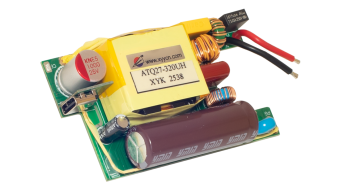 Photo of the EBC10296 internal power‑supply PCB showing the transformer, capacitors, inductors, fuse, and USB output port used for AC‑to‑DC conversion and power regulation.
