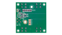 Bottom view of the EVB-RTP100E2P6G1FL evaluation board showing PCB routing, passive components, solder pads, and connection points