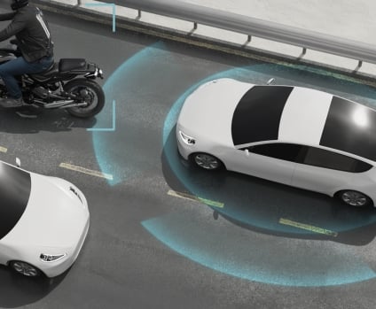 Car on highway road with ADAS radar scanning other vehicles.