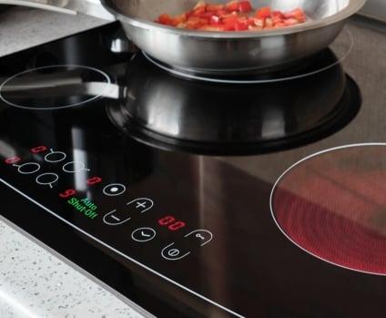 Auto shut-off indicator on control panel turned of modern electric cooking stove.