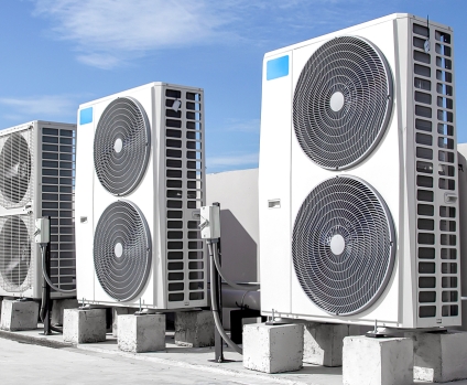 Air conditioners (HVAC) installed on the roof of industrial buildings.