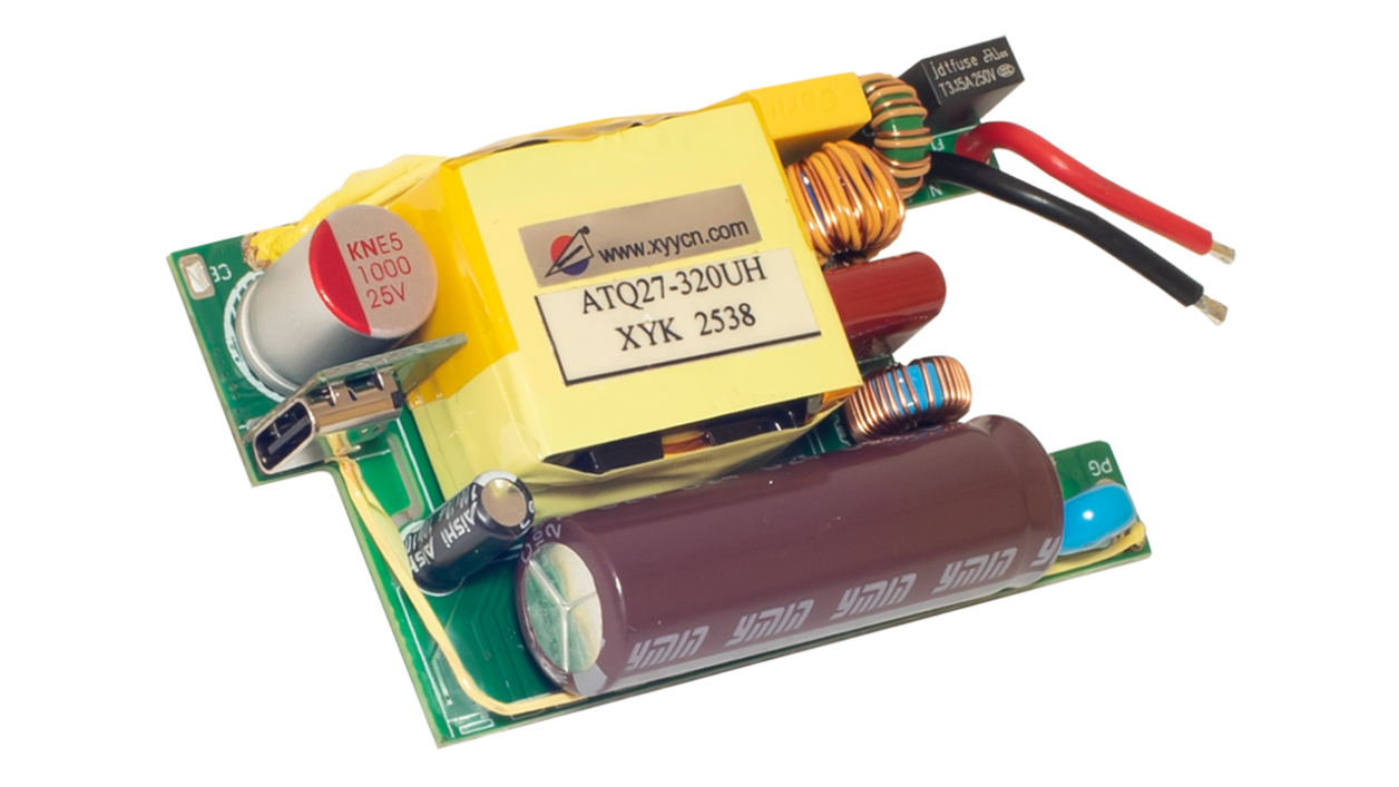 Photo of the EBC10296 internal power‑supply PCB showing the transformer, capacitors, inductors, fuse, and USB output port used for AC‑to‑DC conversion and power regulation.