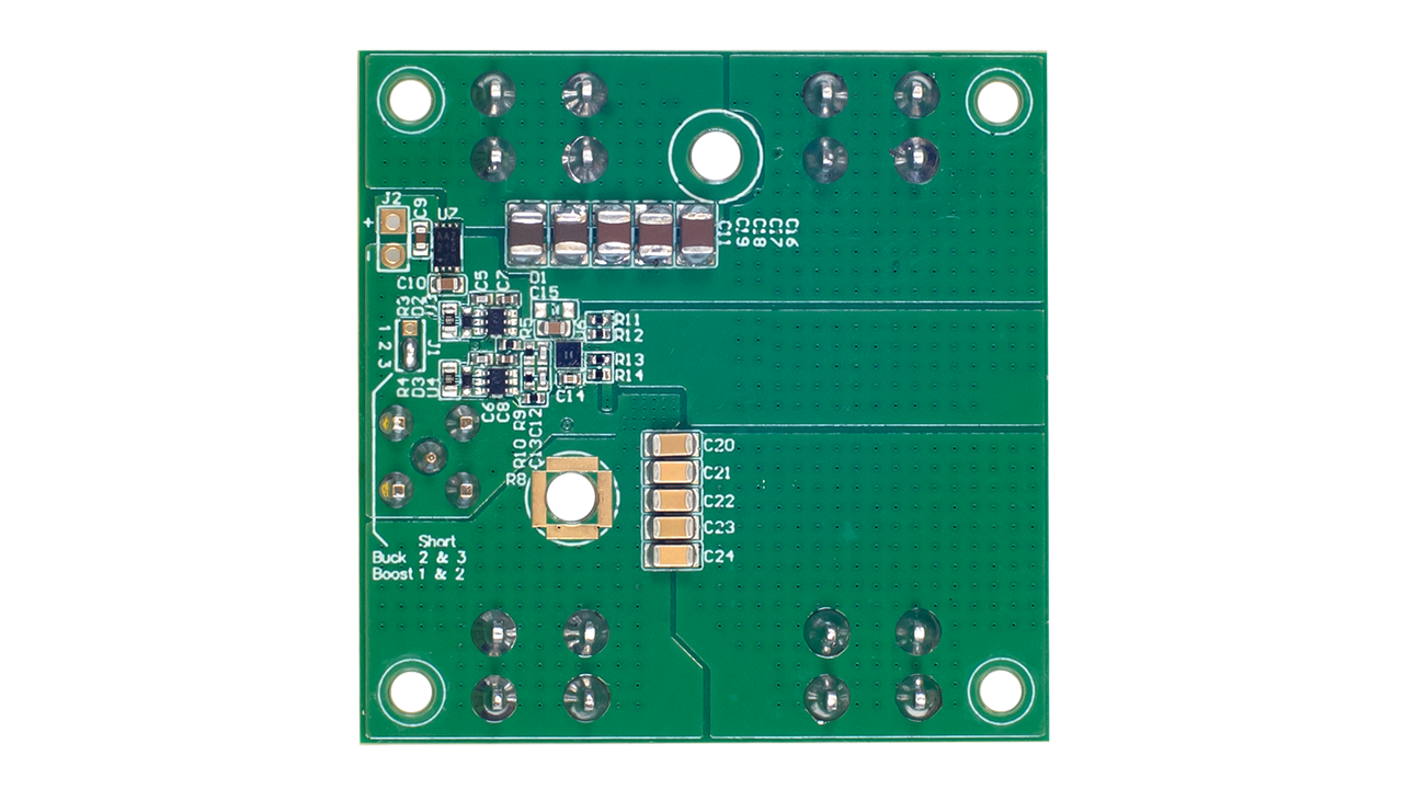 Bottom view of the EVB-RTP100E2P6G1FL evaluation board showing PCB routing, passive components, solder pads, and connection points
