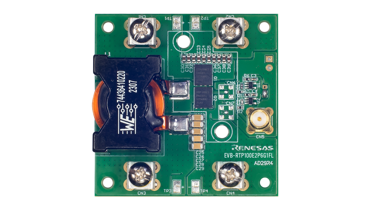 Top view of the EVB-RTP100E2P6G1FL evaluation board showing the RTP100E2P6G1FL GaN FET, onboard components, test points, and input/output connection terminals
